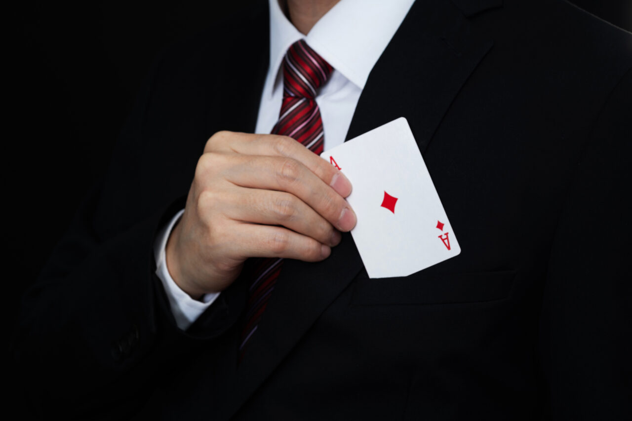 Businessman pull an ace out of pocket